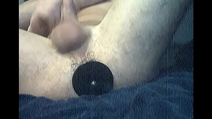 artificial dick of a dark shade fucks in the ass
